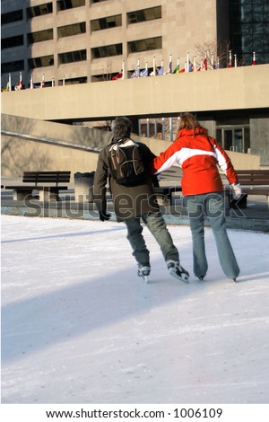 couple skating in city park