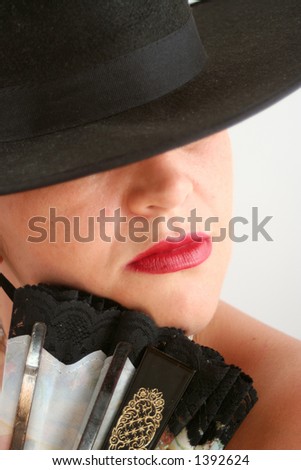 Spanish woman with hat and fan