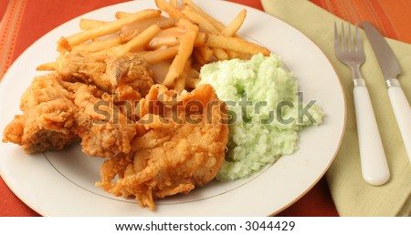 fried chicken, french fries with gravy and coleslaw dinner