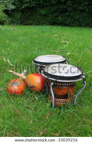 Colorful latin rhythm instruments, a set of bongo drums and a pair of maracas
