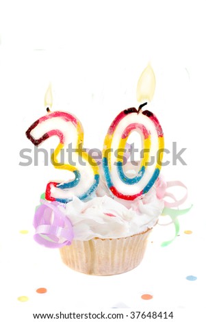thirtieth birthday cupcake with white frosting on a white background