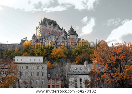 Beautiful color manipulated architectural chateau building in Quebec City, in the province of Quebec, Canada, with fall trees in the foreground