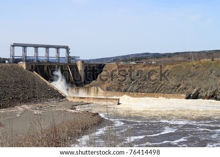 Dam producing energy through water in Mactaquac, outside of Fredericton NB,  Canada