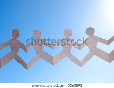 paper people  chain representing teamwork over blue sky