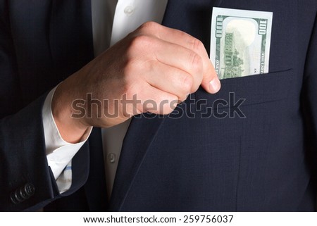 Bribe in businessmen\'s pocket. Euro banknotes isolated on a grey background. Man counts money euro isolated on blue background. Man hides money in his pocket.