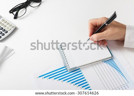 Businessman counting losses and profit working with statistics, analyzing financial the results