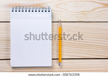 Back to school. Blank notepad, notebook with pen on wooden background. Copy Space. Education background