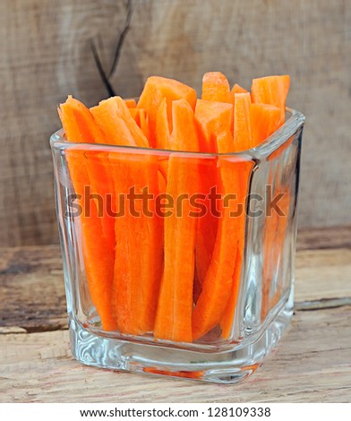 Carrot slices on wooden background