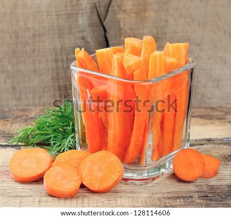 Carrot slices on wooden background