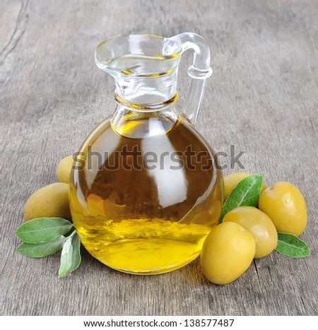 Olives and a bottle of olive oil