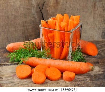 Carrots slices on wooden background