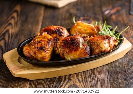 Similar – Image, Stock Photo Roasted marinated chicken pieces with vegetables in black baking dish