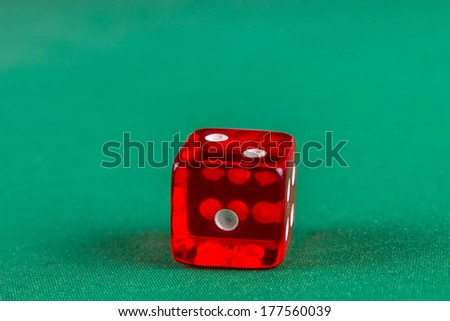Red dice on green felt