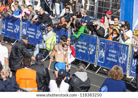 ATHENS,GREECE - NOV 11: 30th Athens Classic Marathon a hard race of 42,195 m. Greece\'s Parmakis Michail reaching finish line at the Panathenean stadium, November 11, 2012 in Athens,Greece