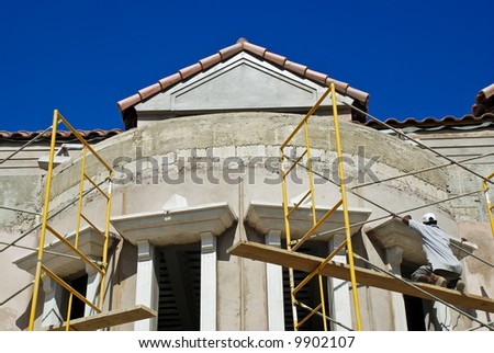 A construction worker works on a new office building