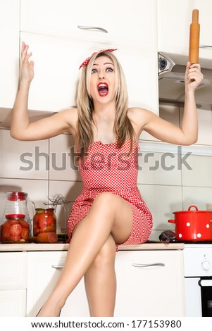 Woman in the kitchen preparing food for the holiday. Wife meets her husband emotionally.