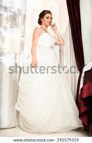 Slim beautiful woman wearing luxurious wedding dress. Wedding Dress.