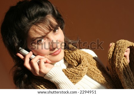 Woman calling by silver mobile phone.