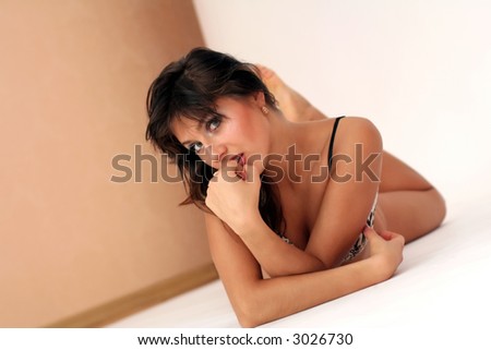 Beautiful young woman Laying on floor.