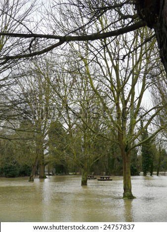 WITHAM, ESSEX, UK - FEBRUARY 10, 2009: Heavy overnight rain on top of melting snow has caused the local river to burst its banks, flooding roads, carparks & most of the riverside green areas on Feb 10, 2009