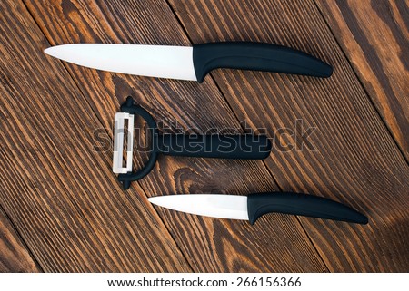 Ceramic Knife Set against the backdrop of a dark table.