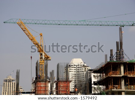 New large buildings under construction in a large Asian city. Horizontal image.