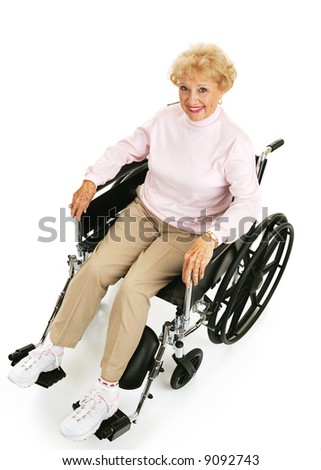 Beautiful, optimistic senior lady in a wheelchair.  Full body isolated on white.