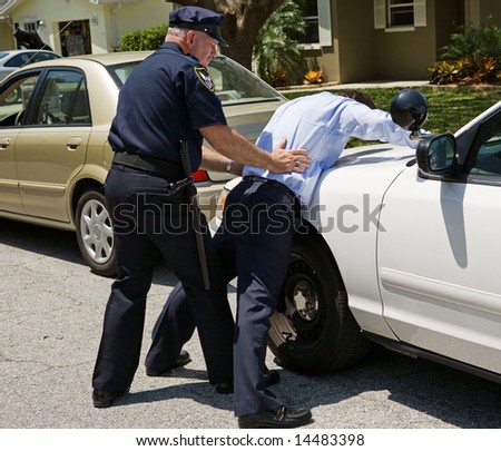 Drunk Driver Spread Eagle On The Police Car, Being Patted Down. Stock ...