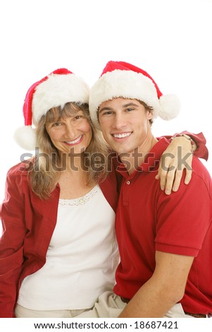 Pretty middle aged mom and her handsome college aged son, together for Christmas.  White background.