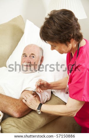 Homebound senior man gets an injection from his nurse.