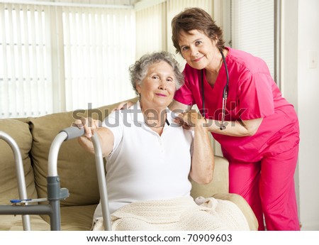 Friendly nurse cares for an elderly woman in a nursing home.