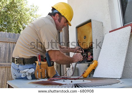 An air conditioning repairman working on a heat recovery unit. Stock photo © 