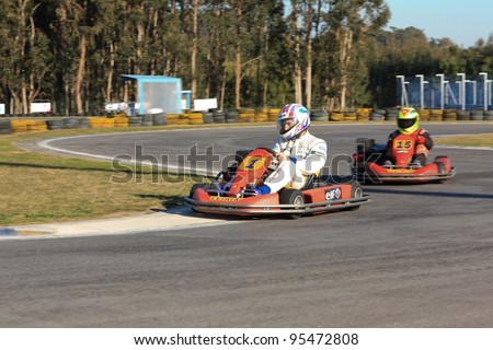 LEIRIA, PORTUGAL - JANUARY 28: An unknown driver/team participating in Old Motor Club Of Marinha Grande Karting Race, organized by Motor Club Of Marinha Grande, in Leiria, Portugal on January 28, 2012.