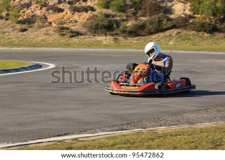 LEIRIA, PORTUGAL - JANUARY 28: An uknown driver/team participating in Old Motor Club Of Marinha Grande Karting Race, organized by Motor Club Of Marinha Grande, in Leiria, Portugal on January 28, 2012.