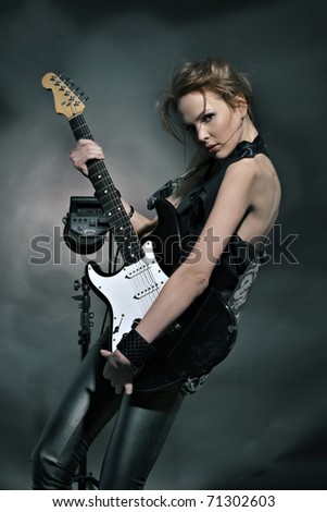Fashion girl with guitar playing hard-rock!