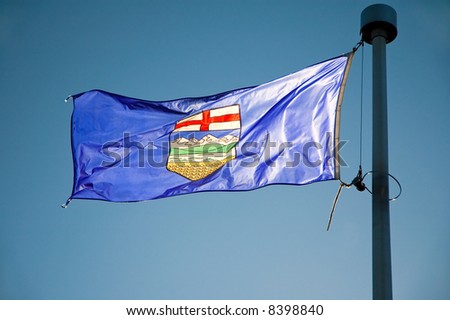 Alberta\'s provincial flag flying from a flag pole.