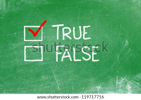 True or False written on green plate with white chalk.