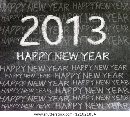 Happy new year 2013 written in white chalk on blackboard