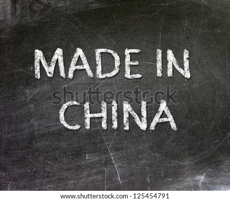 Made in China handwritten with white chalk on a blackboard.