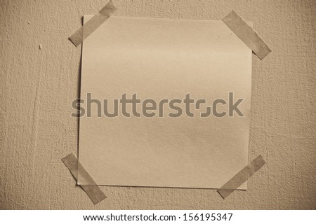 Sticky note on the brown wall
