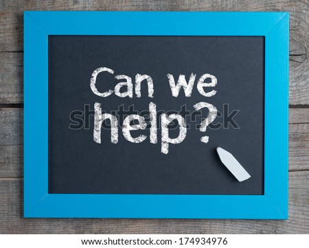 Can we help ? written on blue framed chalkboard on wooden background
