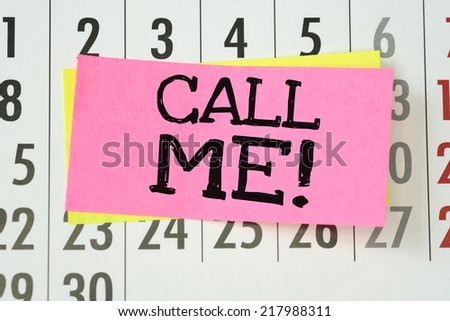 Call Me with an exclamation mark written by hand on sticky paper note and stuck to a wall calendar background.