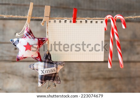 Paper attach to rope. Checkered paper attach to rope, textile stars, christmas candies