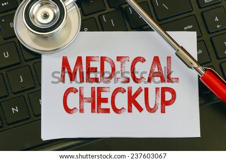 Medical checkup and stethoscope. Medical checkup sign and stethoscope. Medicine concept on computer keyboards