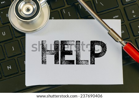 Help sign and stethoscope. Help sign and stethoscope. Medicine concept on computer keyboards