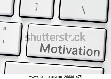 Keyboard with motivation buton. Computer white keyboard with motivation button