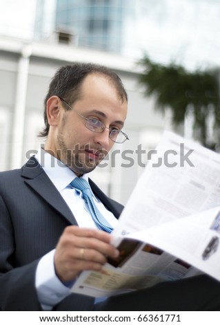 Businessman reading journal