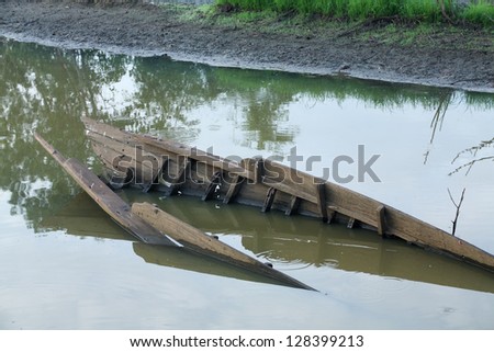 sunk boat in canal.
