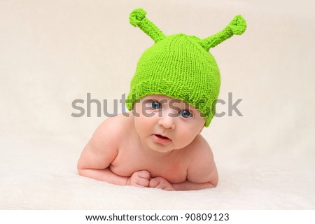 baby in funny green Christmas hat