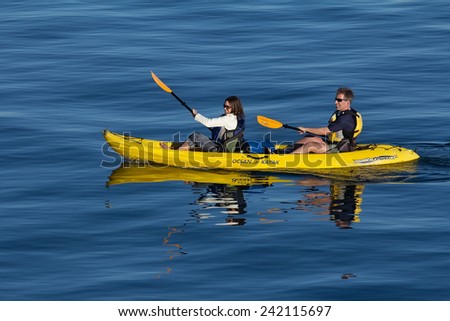 SANTA CRUZ, CA/USA -January 7 - unidentified caucasian couple kayaking in blue water on January 7, 2015 in Santa Cruz Bay